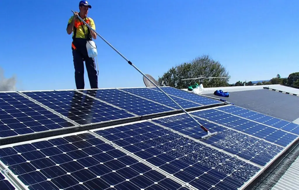 Washing rooftop solar panels on a Bay of Plenty home