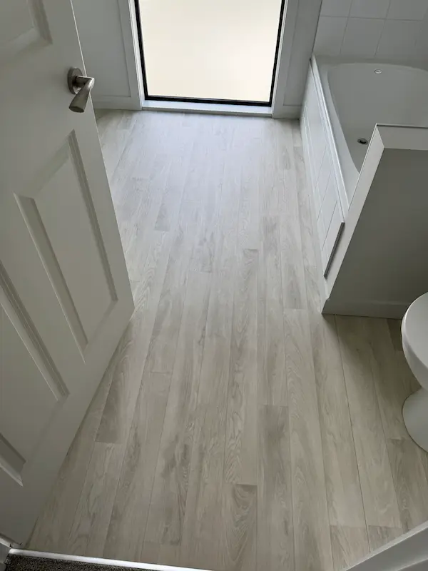Freshly cleaned bathroom floor tiles gleaming after bond clean in Bay of Plenty