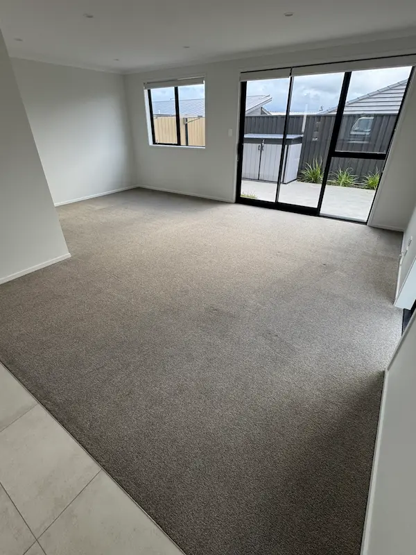 Freshly cleaned lounge carpet ready for inspection after tenancy clean in Tauranga