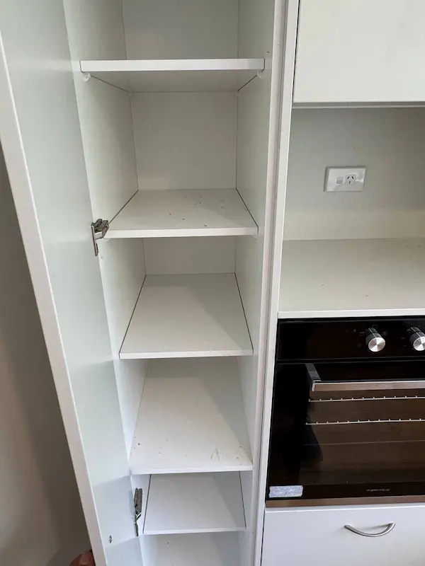 Cleaned kitchen cupboard and pantry interior during bond clean in Tauranga
